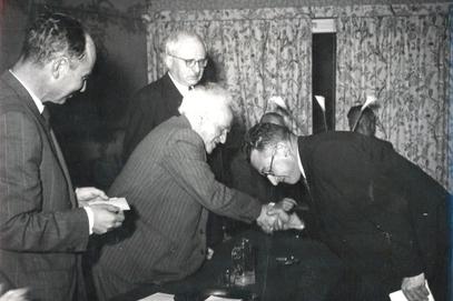 Oren receiving his first prize from Ben Gurion. Barav on left.